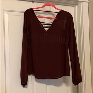 Purple cut out blouse.